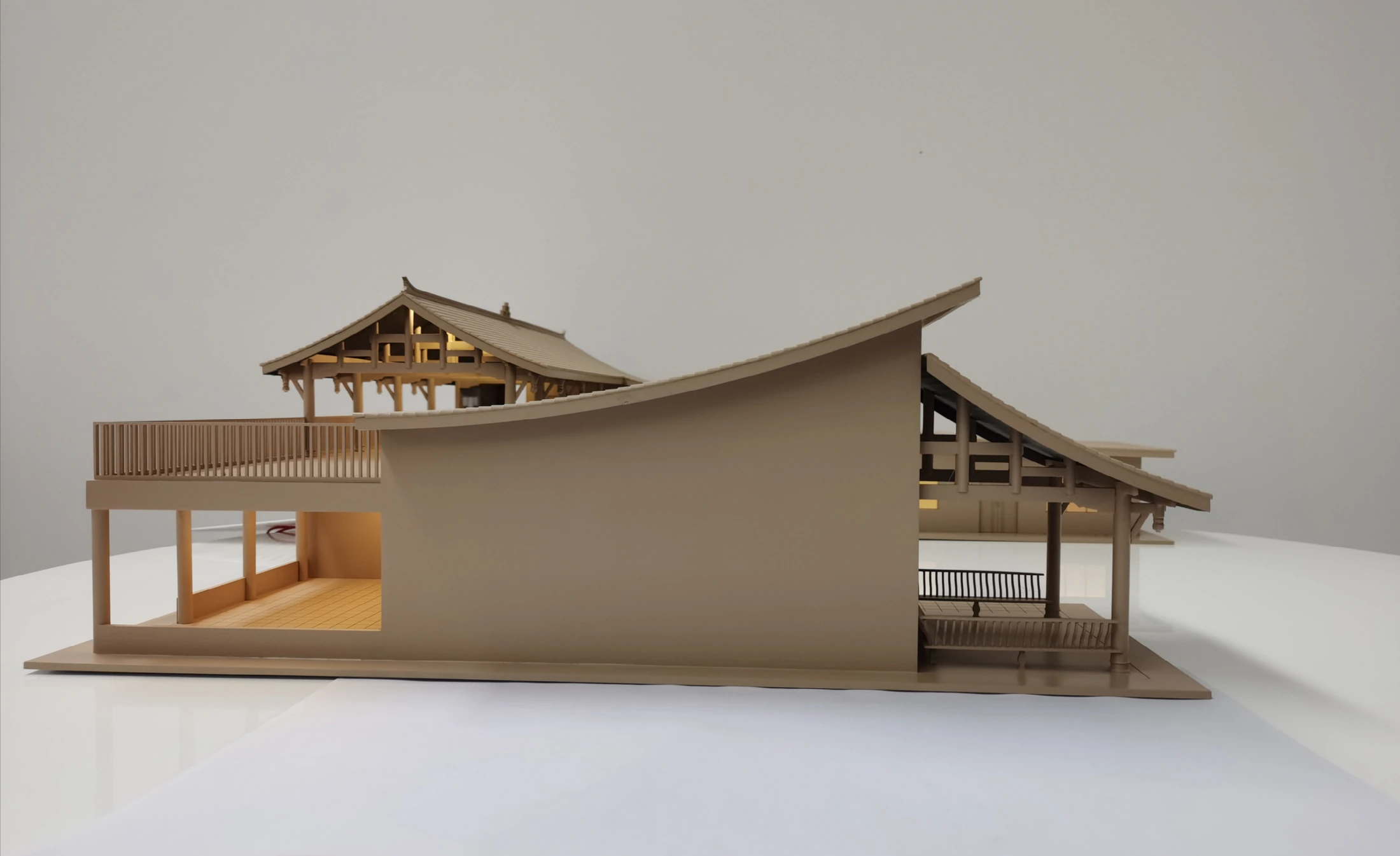 Physical model of Nanxi Yao, showing curved roofs, a central wall and open columned spaces